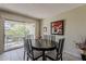 Dining room with sliding door access to the exterior patio at 4201 E Camelback Rd # 74, Phoenix, AZ 85018