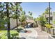 A tranquil entrance with mature trees and desert landscaping welcomes residents and guests at 4201 E Camelback Rd # 74, Phoenix, AZ 85018