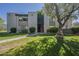 Condo exterior with mature landscaping and well-maintained lawn at 4201 E Camelback Rd # 74, Phoenix, AZ 85018