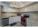 Bright kitchen featuring white cabinets and stainless steel appliances at 4201 E Camelback Rd # 74, Phoenix, AZ 85018