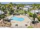 Aerial view of a community pool surrounded by palm trees and lounge chairs at 4201 E Camelback Rd # 74, Phoenix, AZ 85018