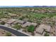 Expansive aerial view of the community featuring desert landscaping, single-story homes and golf course at 42122 N Anthem Springs Rd, Anthem, AZ 85086