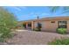Desert backyard featuring a covered patio and well-maintained landscaping at 42122 N Anthem Springs Rd, Anthem, AZ 85086