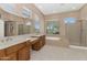 Large bathroom features double sinks, soaking tub, and separate shower at 42122 N Anthem Springs Rd, Anthem, AZ 85086