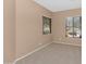 Neutral bedroom with carpeted floors, window blinds and ample natural light at 42122 N Anthem Springs Rd, Anthem, AZ 85086