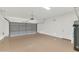 Spacious garage with epoxy floors, ample storage, and door to interior of house at 42122 N Anthem Springs Rd, Anthem, AZ 85086