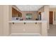 Inviting kitchen view with stainless steel appliances, breakfast bar, and ample cabinet space for storage at 42122 N Anthem Springs Rd, Anthem, AZ 85086