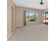 Another view of the living room leading to a backyard patio with barbecue at 42122 N Anthem Springs Rd, Anthem, AZ 85086