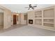 Inviting living room with a fireplace and decorative shelving offers a comfortable space at 42122 N Anthem Springs Rd, Anthem, AZ 85086