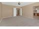 Expansive main bedroom with neutral colors, carpet, and access to main bath at 42122 N Anthem Springs Rd, Anthem, AZ 85086
