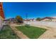 Large backyard featuring artificial turf, gravel, and a privacy fence at 4501 N 60Th Ave, Phoenix, AZ 85033