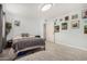Neutral bedroom with tile flooring, a window, and a cozy bed at 4501 N 60Th Ave, Phoenix, AZ 85033