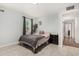Neutral bedroom with tile flooring, a window, and a cozy bed at 4501 N 60Th Ave, Phoenix, AZ 85033
