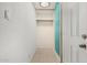 Small, open closet space featuring tile flooring, white paint, and open storage at 4501 N 60Th Ave, Phoenix, AZ 85033