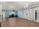 Large living room with neutral tile flooring, chandelier, and an open layout at 4501 N 60Th Ave, Phoenix, AZ 85033