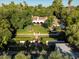 Aerial view of sprawling estate featuring lush landscaping, red tile roof, sparking pool, fountain and private gardens at 5225 N 23Rd St, Phoenix, AZ 85016
