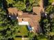 An aerial shot highlights the intricate roof design surrounded by green landscaping and a circular walkway at 5225 N 23Rd St, Phoenix, AZ 85016