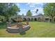 Lush backyard with a decorative fountain, well-maintained lawn, and picturesque landscaping at 5225 N 23Rd St, Phoenix, AZ 85016