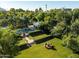 Expansive backyard with a lush lawn, mature trees, pool, and manicured landscaping, creating a private oasis at 5225 N 23Rd St, Phoenix, AZ 85016