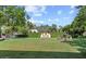 Expansive backyard featuring a well-manicured lawn, mature trees, and an elegant fountain at 5225 N 23Rd St, Phoenix, AZ 85016
