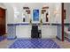 Bright bathroom featuring blue tile flooring and accents, complemented by white vanities and wood beams at 5225 N 23Rd St, Phoenix, AZ 85016