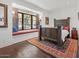 Spacious bedroom with decorative window seat, hardwood floors, and natural lighting at 5225 N 23Rd St, Phoenix, AZ 85016
