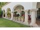 Charming covered patio with fireplace, dining area, and potted plants, creating an inviting outdoor space at 5225 N 23Rd St, Phoenix, AZ 85016