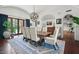 Well-appointed dining room featuring vaulted ceilings, stylish chandelier, and elegant furniture, creating a refined dining experience at 5225 N 23Rd St, Phoenix, AZ 85016