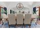 Bright dining room with large windows, a chandelier, and a spacious table, ideal for gatherings at 5225 N 23Rd St, Phoenix, AZ 85016