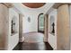 Elegant foyer featuring stone columns, arched doorways, and patterned tile flooring at 5225 N 23Rd St, Phoenix, AZ 85016