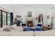 Cozy living room with vaulted ceilings, fireplace, and plush seating, ideal for relaxing at 5225 N 23Rd St, Phoenix, AZ 85016