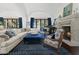 Bright living room with vaulted ceilings, a decorative fireplace, and comfortable seating, perfect for entertaining at 5225 N 23Rd St, Phoenix, AZ 85016