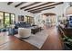 Open concept living room with beamed ceilings, hardwood floors, comfortable seating and easy access to kitchen at 5225 N 23Rd St, Phoenix, AZ 85016