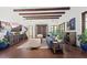 Open living room with hardwood floors, beamed ceilings, comfortable seating, and great natural light at 5225 N 23Rd St, Phoenix, AZ 85016