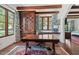 Home office with built-in desk, beamed ceilings, custom cabinetry, and bright windows at 5225 N 23Rd St, Phoenix, AZ 85016