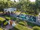 A pool area with mature plants, a large pool, and a white structure at 5225 N 23Rd St, Phoenix, AZ 85016