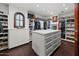 Spacious walk-in closet with custom storage solutions, including shelving, drawers, and hanging racks at 5225 N 23Rd St, Phoenix, AZ 85016