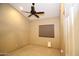 Standard bedroom featuring a ceiling fan, tile flooring, neutral paint and a window with blinds at 5437 W Bluefield Ave, Glendale, AZ 85308