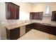 Updated kitchen with granite countertops, stainless steel appliances, and tile backsplash at 5437 W Bluefield Ave, Glendale, AZ 85308
