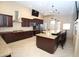 Spacious kitchen with granite countertops, an island with seating and stainless steel appliances at 5437 W Bluefield Ave, Glendale, AZ 85308