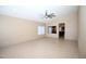 Open-concept living room with neutral paint and views into the eat-in kitchen at 5437 W Bluefield Ave, Glendale, AZ 85308