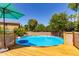 Beautiful backyard featuring a wooden deck surrounding an above ground pool, ideal for relaxation and entertainment at 557 S Lemon Ct, Gilbert, AZ 85296
