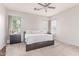 Bright main bedroom with neutral color palette, ceiling fan, carpet and natural light at 557 S Lemon Ct, Gilbert, AZ 85296