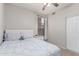 Bedroom with a single bed, side table, and natural light streaming through a window at 557 S Lemon Ct, Gilbert, AZ 85296