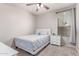 Bedroom with a single bed, side table, and natural light streaming through a window at 557 S Lemon Ct, Gilbert, AZ 85296