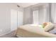 Bedroom with a single bed, side table, and closet with sliding doors at 557 S Lemon Ct, Gilbert, AZ 85296