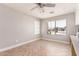 Dining area featuring wood floors, a ceiling fan, and natural light streaming through a window at 557 S Lemon Ct, Gilbert, AZ 85296