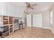 Home office with built in desk, white cabinets, and wood flooring at 557 S Lemon Ct, Gilbert, AZ 85296