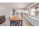 Large kitchen with white cabinets, stainless appliances and a big kitchen island with breakfast bar at 557 S Lemon Ct, Gilbert, AZ 85296