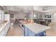 Bright kitchen boasts granite counters, stainless appliances, island with breakfast bar and eat in kitchen table at 557 S Lemon Ct, Gilbert, AZ 85296